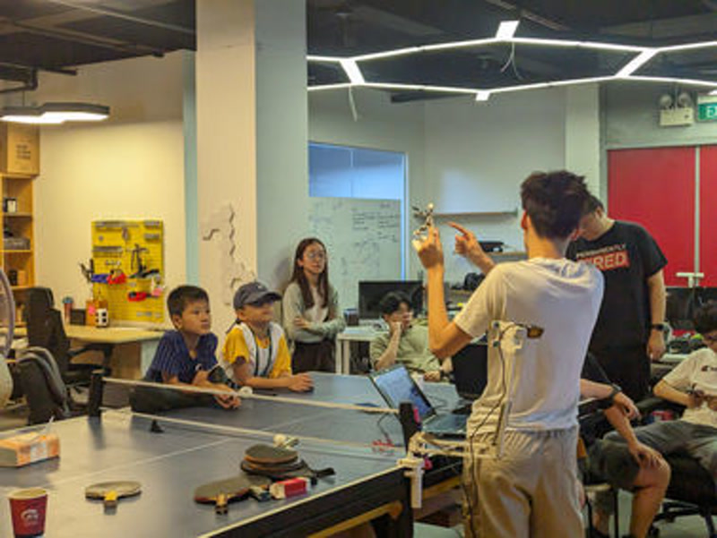 Students building and testing their projects at a NextBuilder maker class
