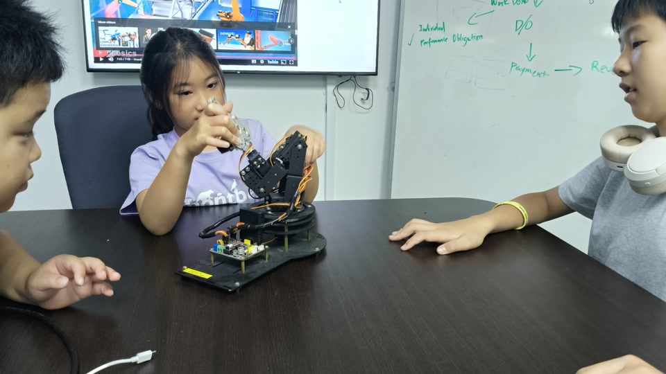 Students building and testing their projects at a NextBuilder maker class